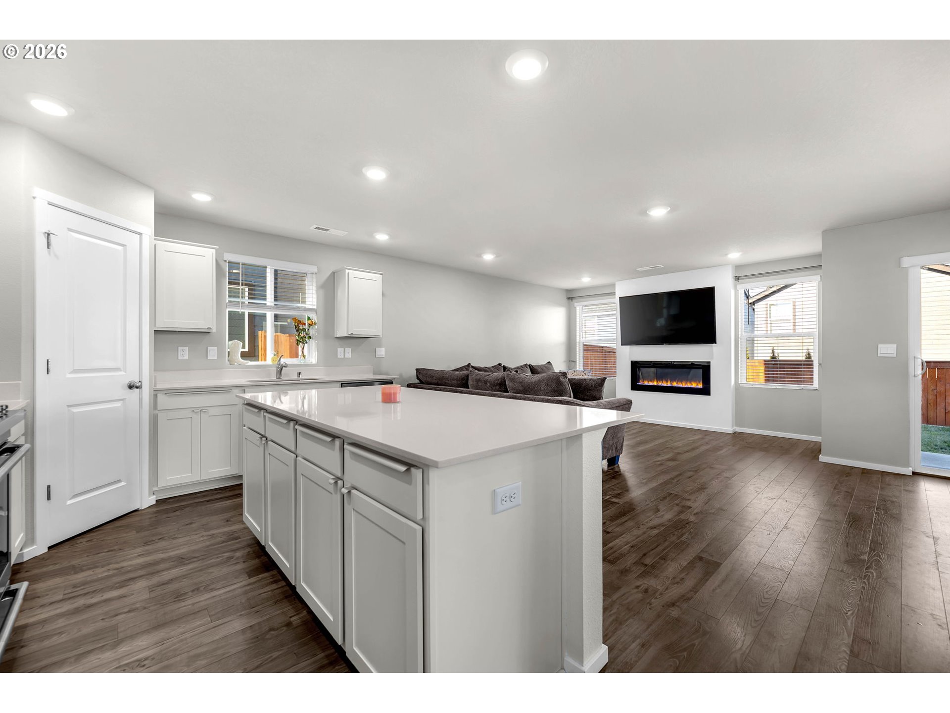 2936 North 3rd Way Ridgefield, WA 98642 - Photo 15 of 44 a kitchen with a sink and a refrigerator