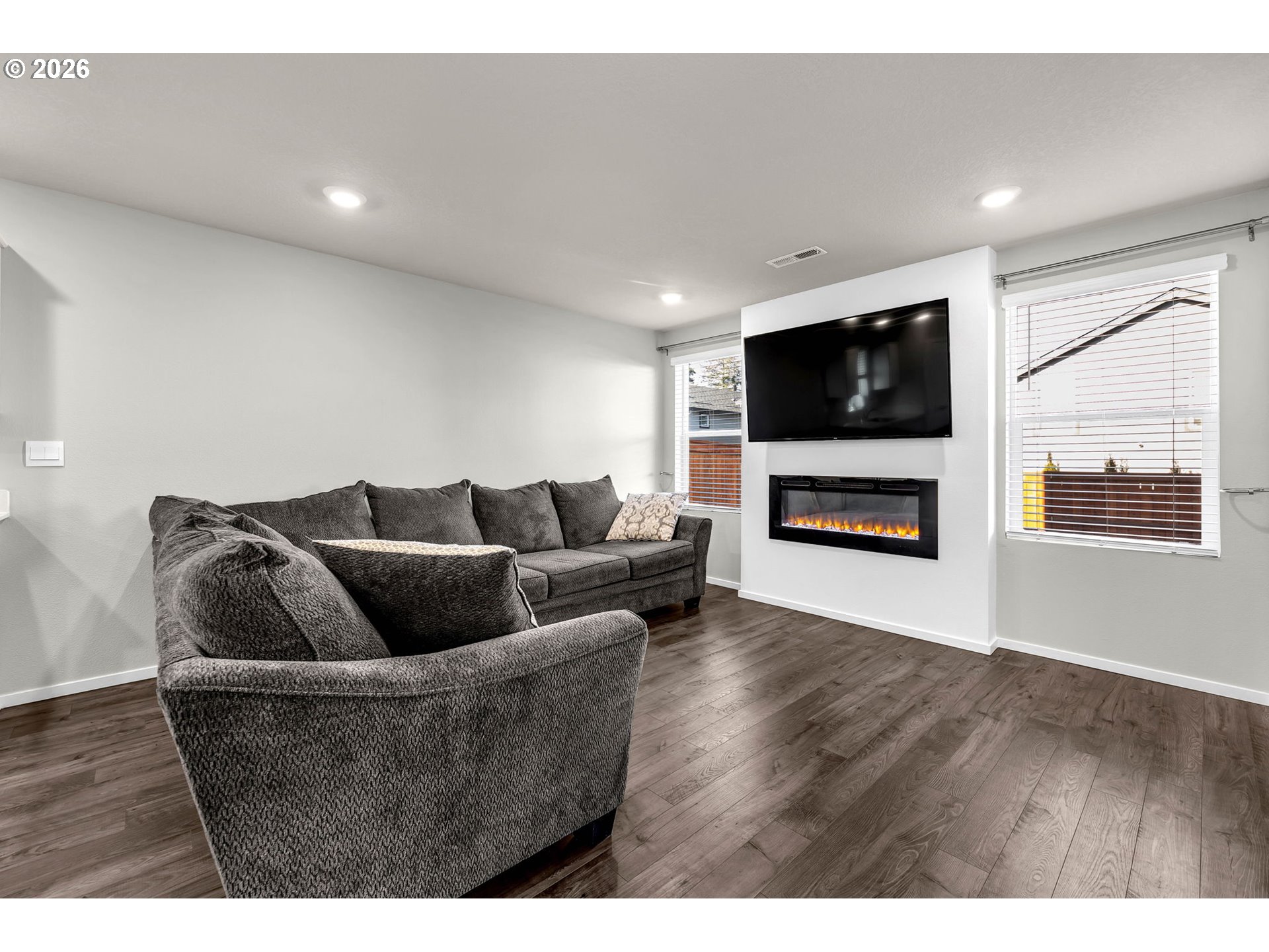 2936 North 3rd Way Ridgefield, WA 98642 - Photo 21 of 44 a living room with furniture and a flat screen tv