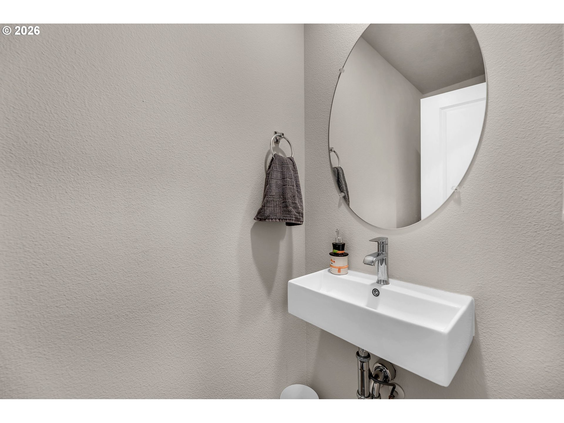 2936 North 3rd Way Ridgefield, WA 98642 - Photo 24 of 44 a bathroom with a sink and mirror