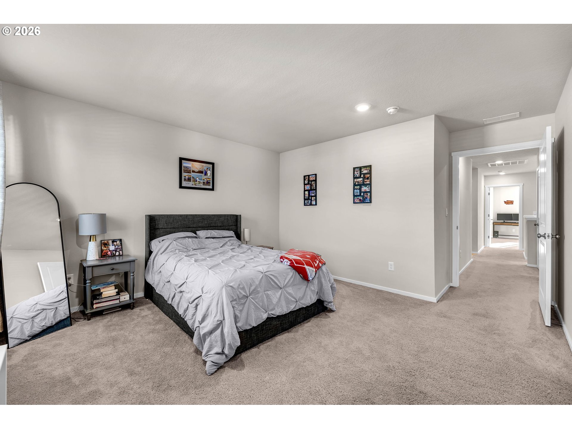 2936 North 3rd Way Ridgefield, WA 98642 - Photo 26 of 44 a spacious bedroom with a bed and a view