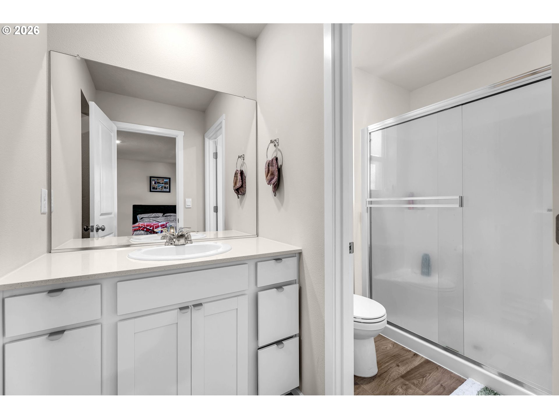 2936 North 3rd Way Ridgefield, WA 98642 - Photo 29 of 44 a bathroom with a sink a toilet and shower