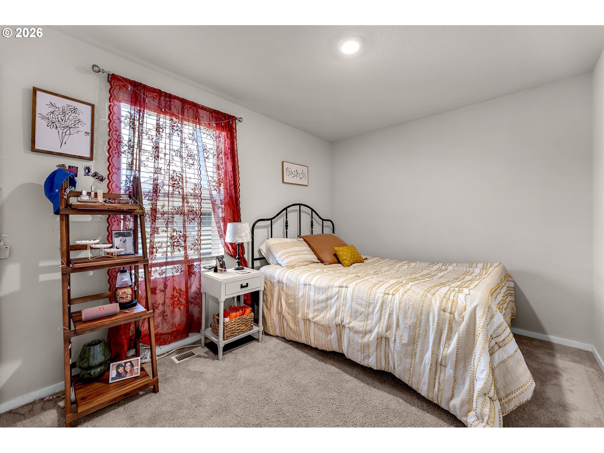 2936 North 3rd Way Ridgefield, WA 98642 - Photo 31 of 44 a bedroom with a bed and a book shelf