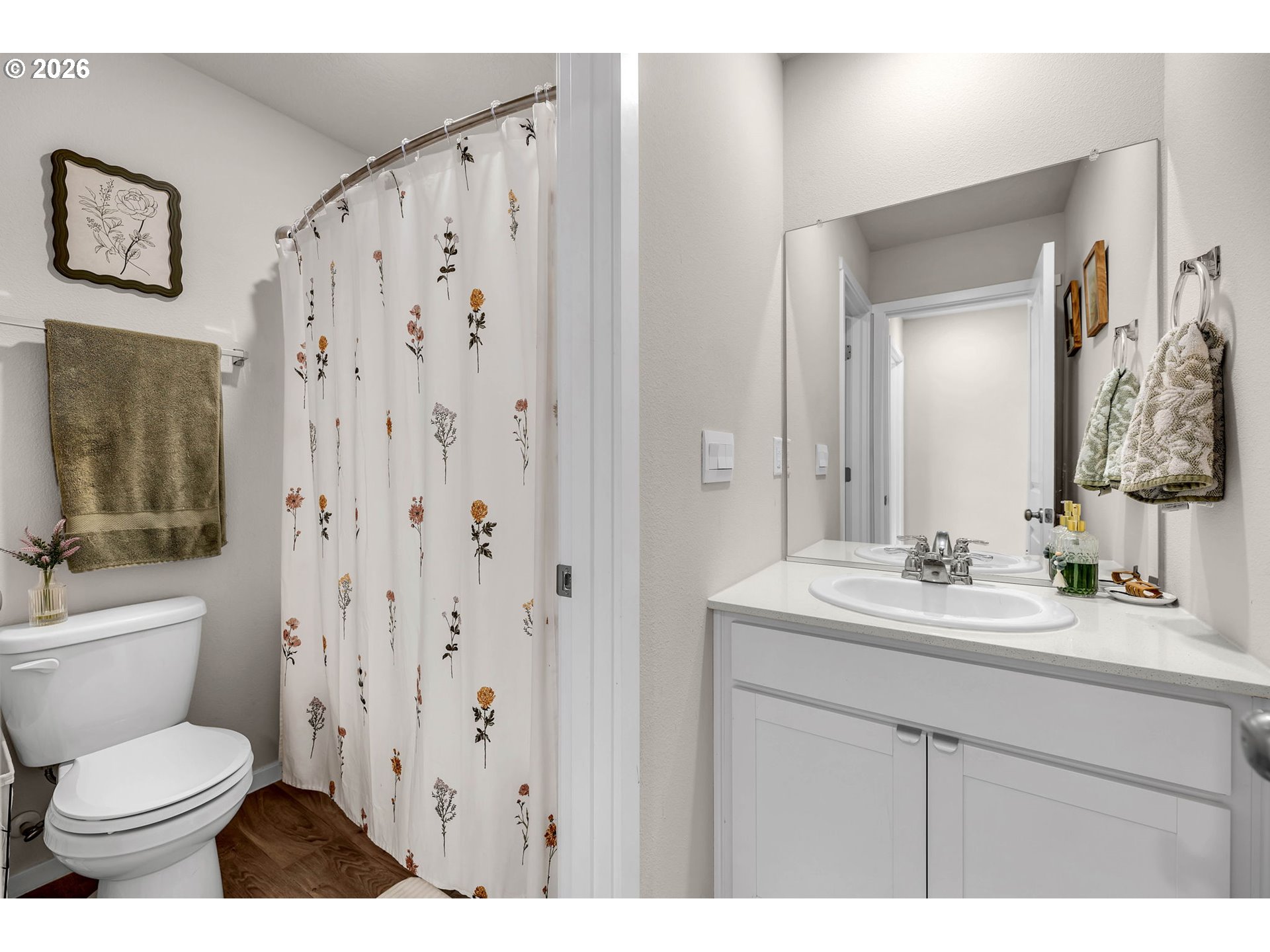 2936 North 3rd Way Ridgefield, WA 98642 - Photo 35 of 44 a bathroom with a toilet a sink and a mirror