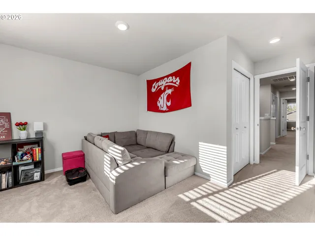 a living room with furniture and a rug