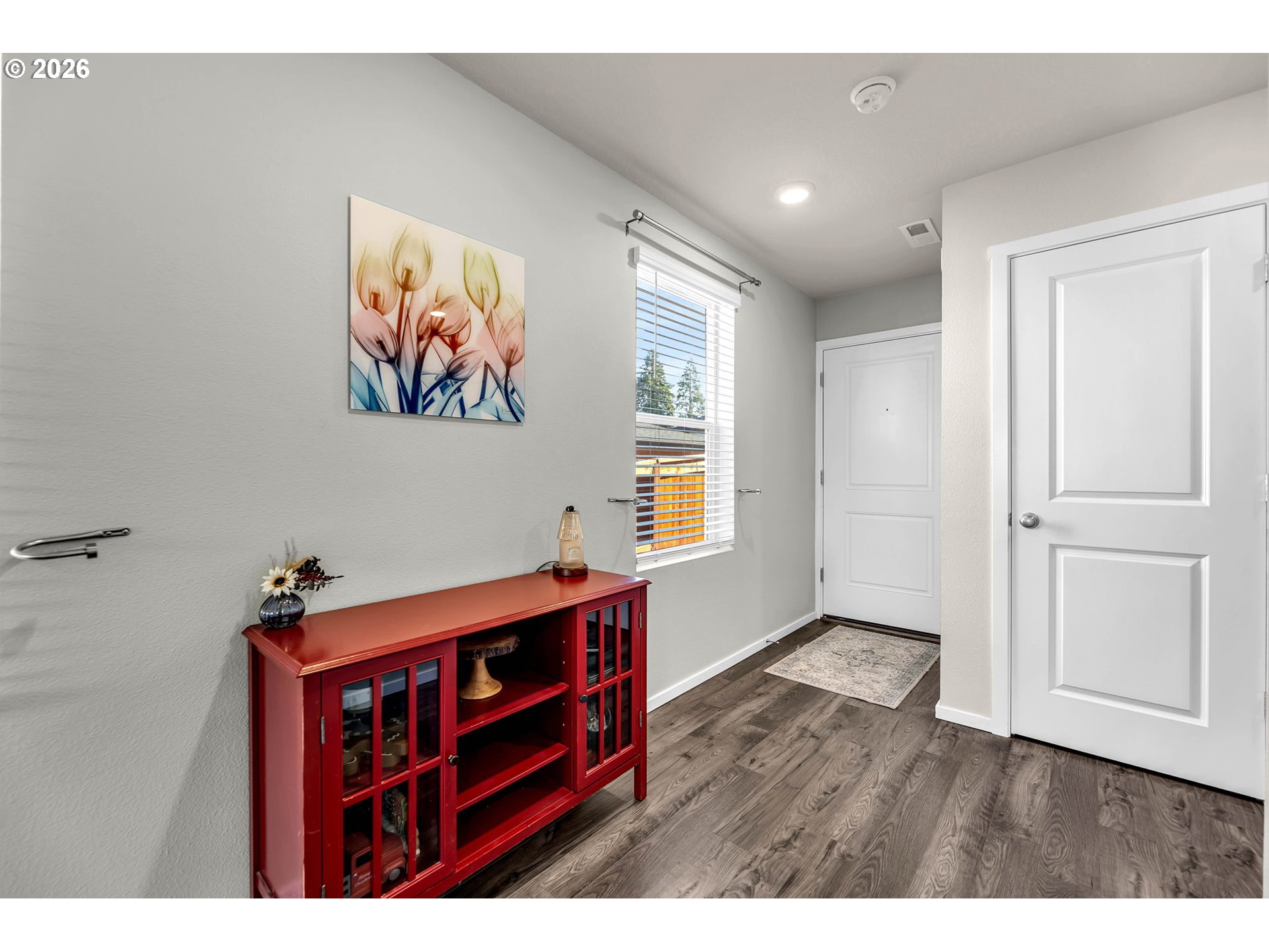 2936 North 3rd Way Ridgefield, WA 98642 - Photo 5 of 44 a view of hallway with window and wooden floor