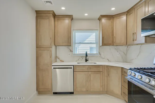 a bedroom with a bed and a mirror