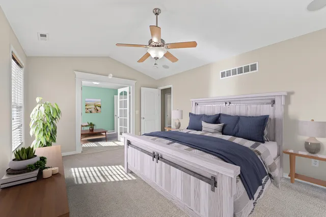 a view of a room with wooden floor and windows
