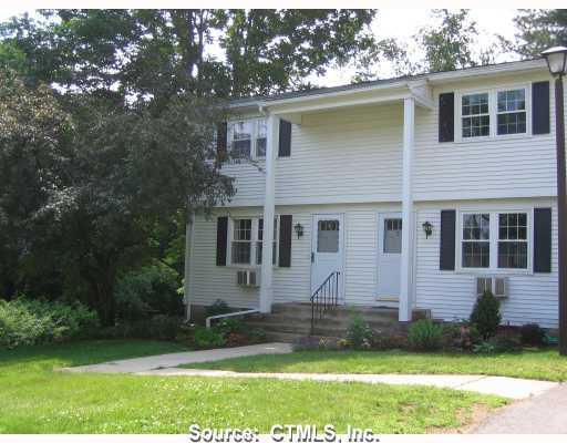 80 Wellswood Road, Unit 5 Hebron, CT 06231 - Photo 1 of 1 a front view of a house with a yard and garage