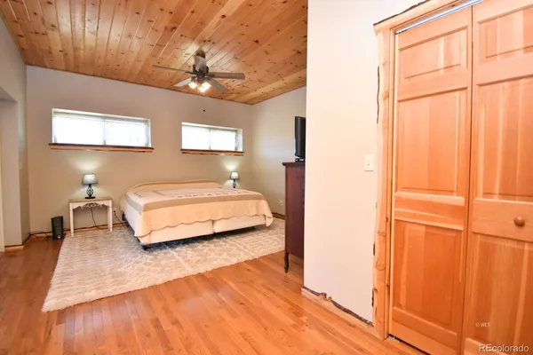 a bedroom with a bed and a table