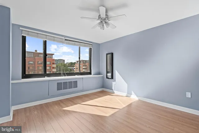 a view of an empty room with a window