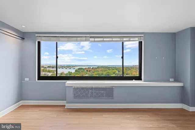 an empty room with a large window