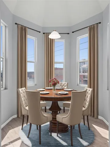 a view of a dining room with furniture window and outside view