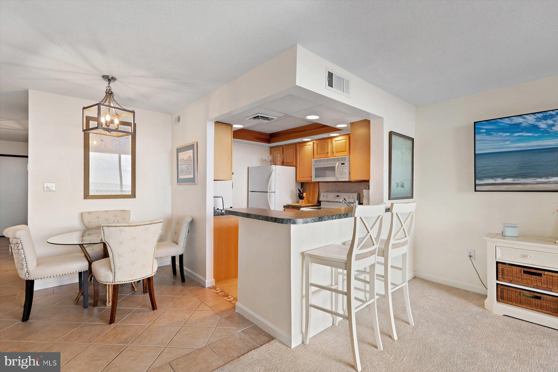 403 North Annapolis House Road Bethany Beach, DE 19930 - Photo 12 of 37 a living room with furniture a dining table and a window
