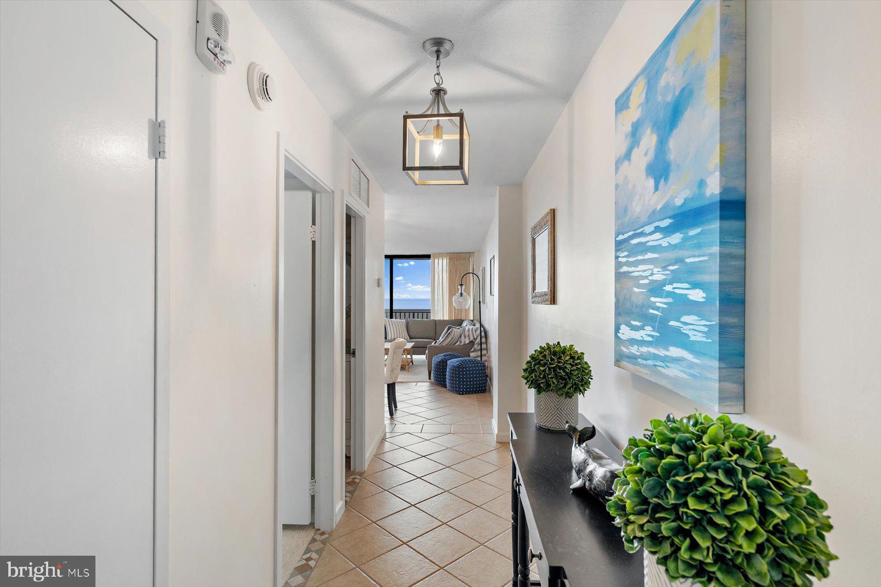 403 North Annapolis House Road Bethany Beach, DE 19930 - Photo 19 of 37 a view of a hallway with wooden floor and windows