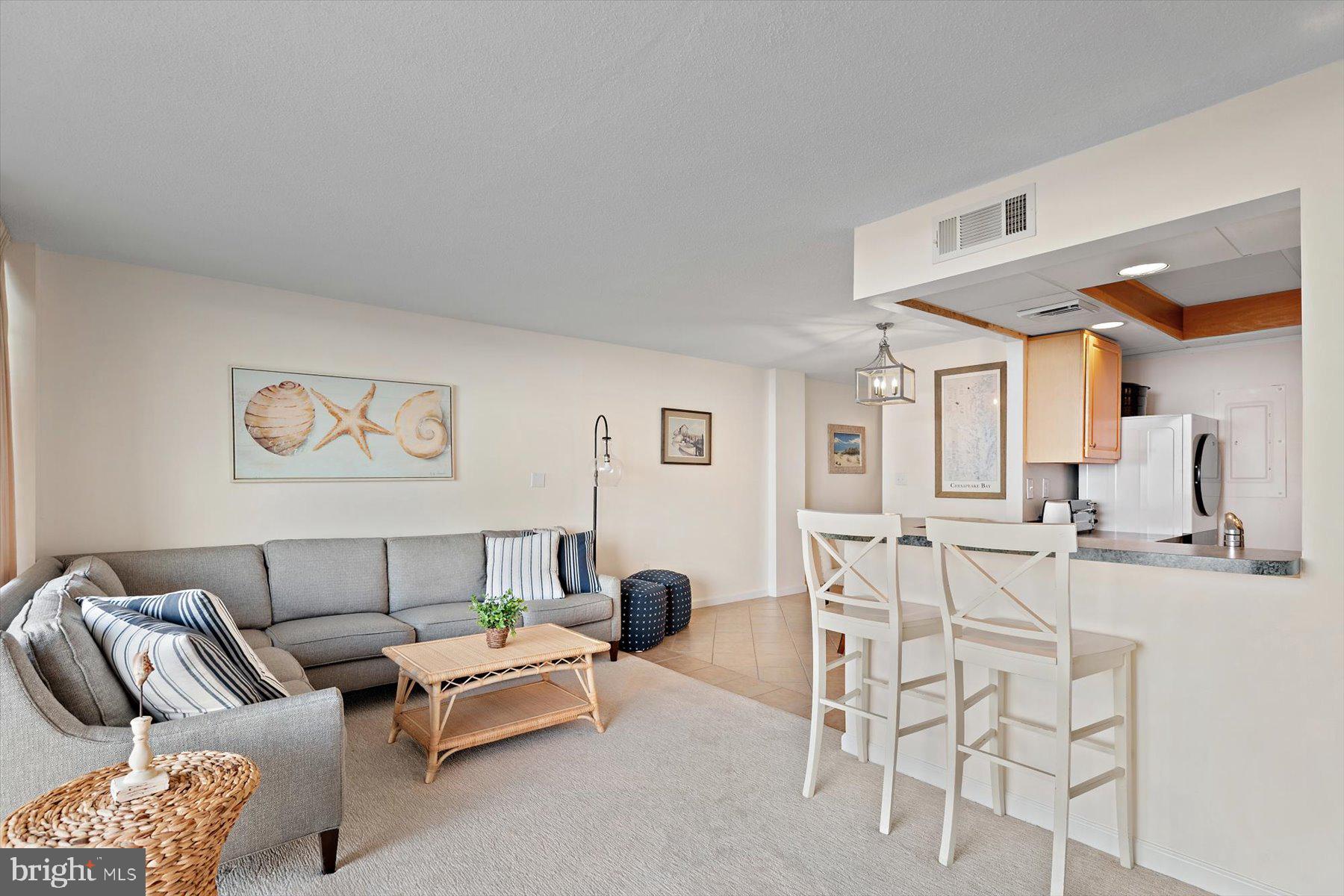 403 North Annapolis House Road Bethany Beach, DE 19930 - Photo 10 of 37 a living room with furniture a rug and white walls