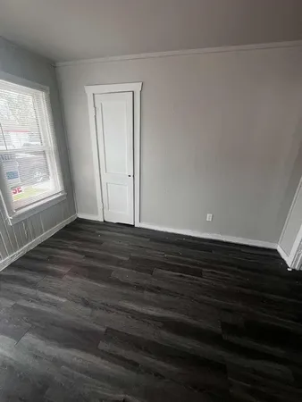 a white toilet sitting next to a shower