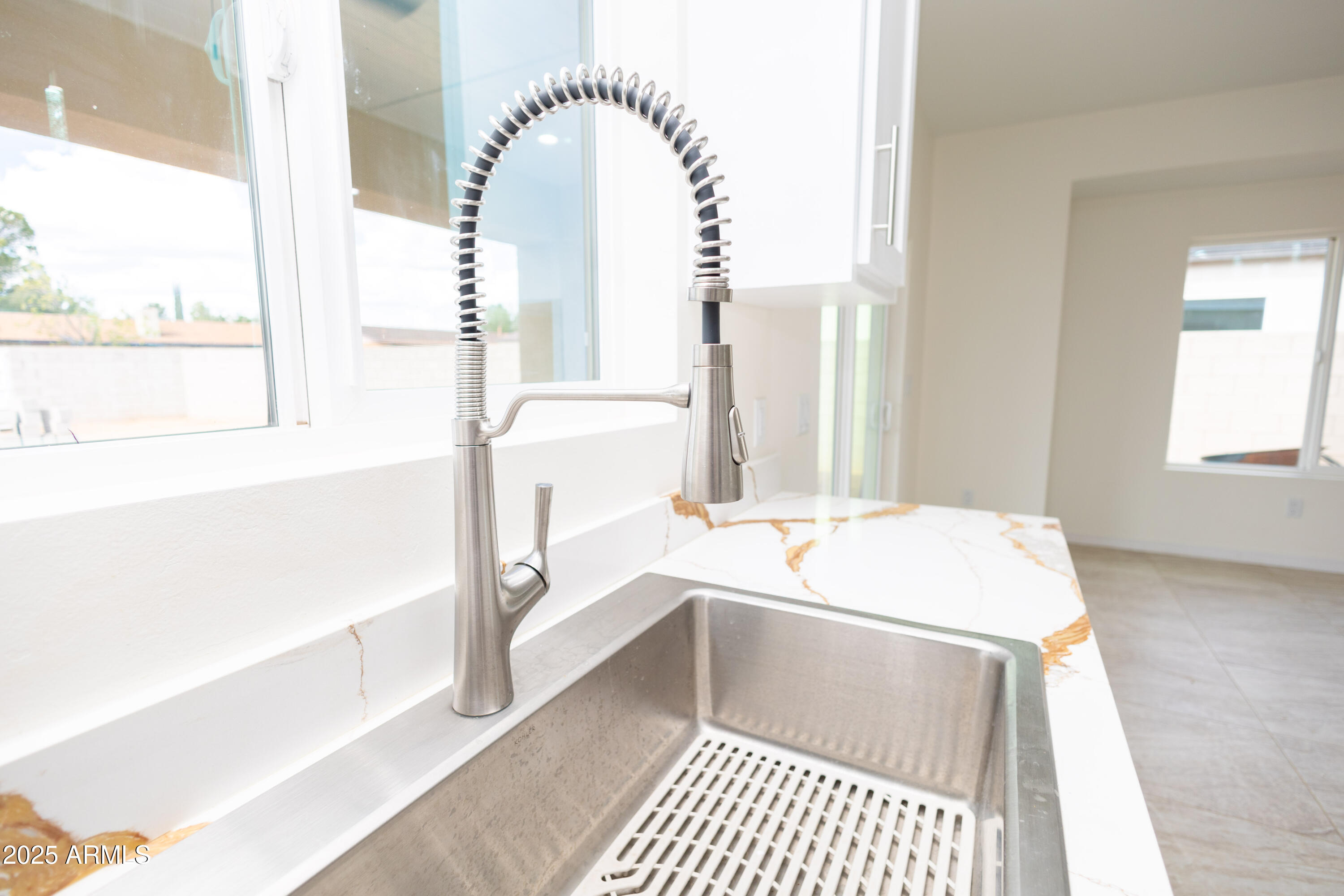 2010 East 13th Street Douglas, AZ 85607 - Photo 19 of 53 a room with a large window and a rug