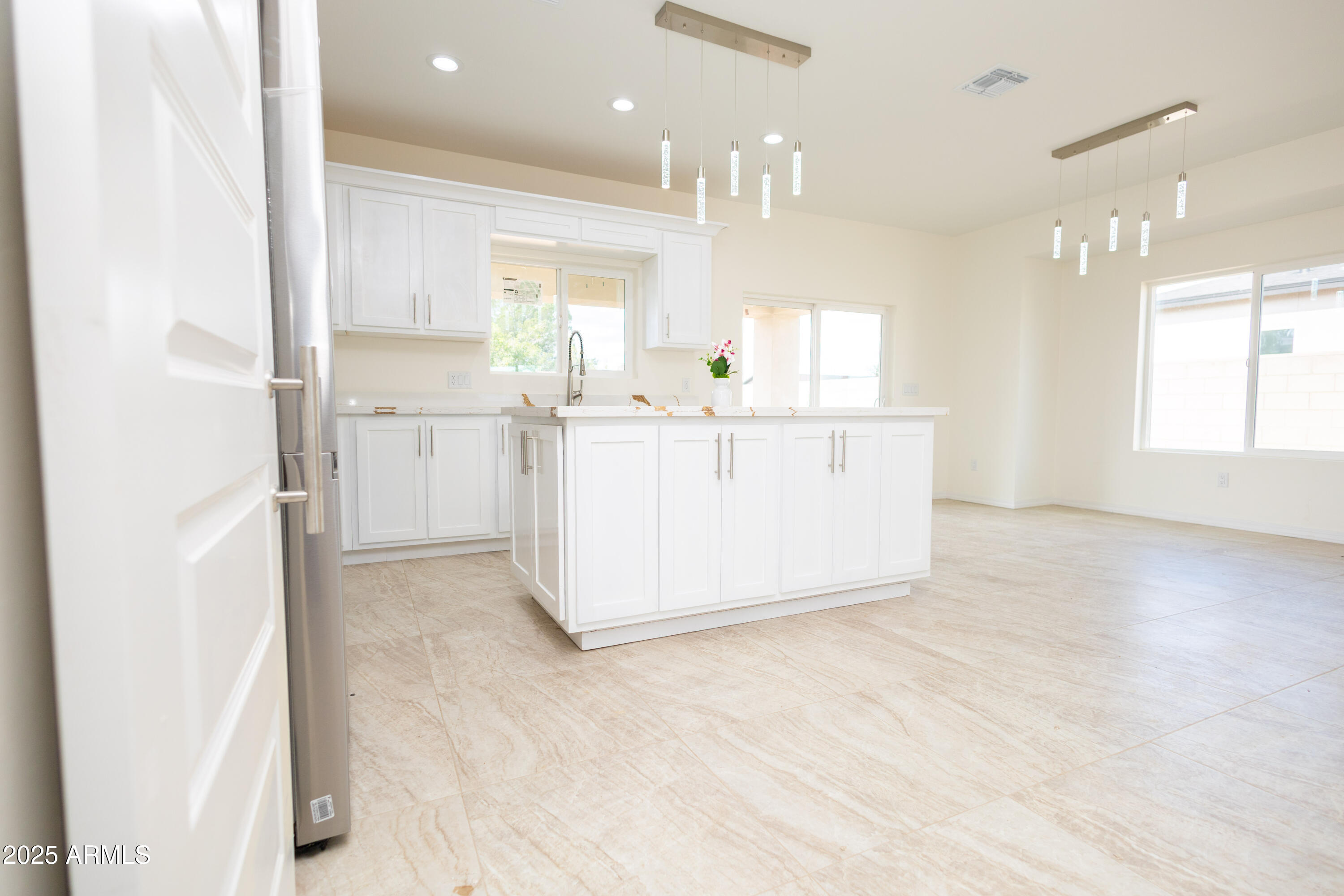 2010 East 13th Street Douglas, AZ 85607 - Photo 27 of 53 a kitchen with stainless steel appliances a refrigerator and a sink