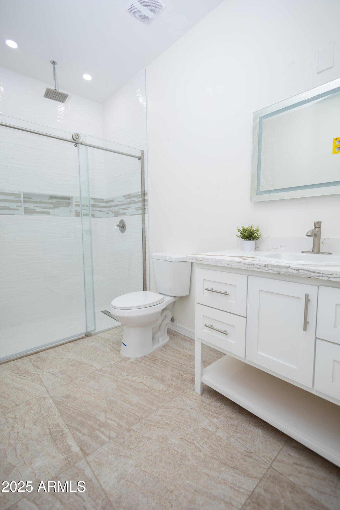 2010 East 13th Street Douglas, AZ 85607 - Photo 33 of 53 a bathroom with a sink a toilet and a mirror