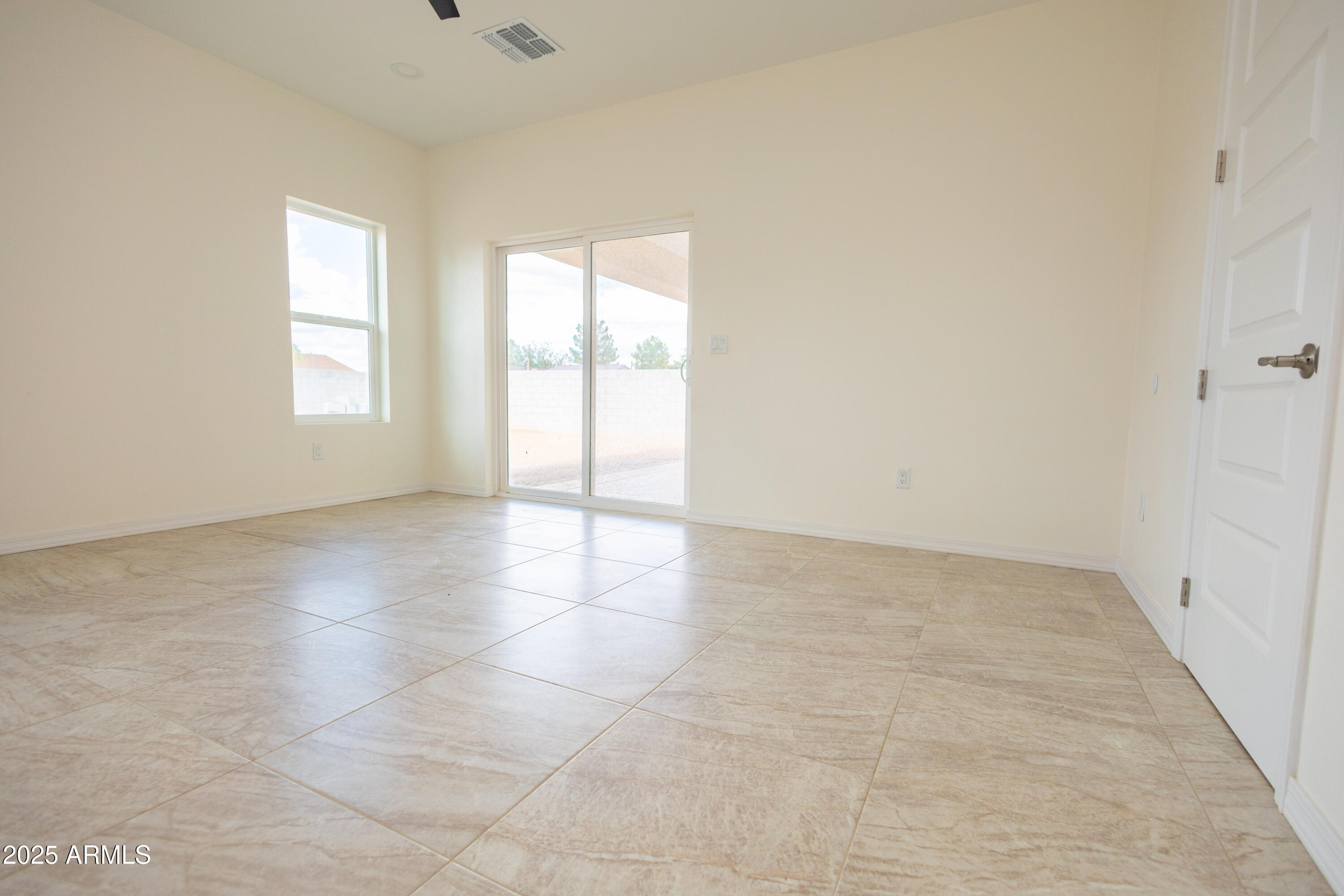 2010 East 13th Street Douglas, AZ 85607 - Photo 39 of 53 wooden floor in an empty room with a window