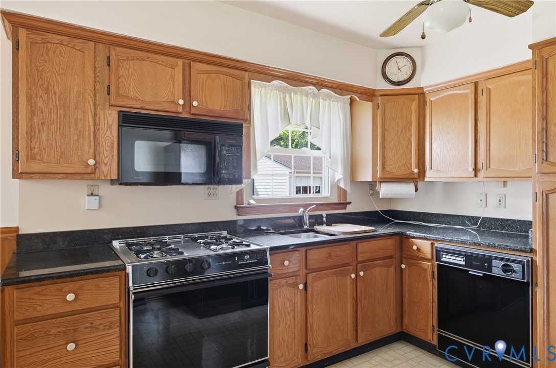 3200 Valleyfield Road Henrico, VA 23228 - Photo 12 of 32 Kitchen featuring wood cabinetry, dark countertops