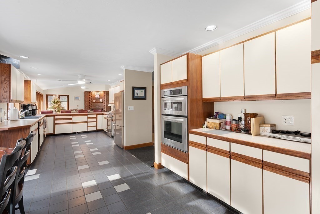 47 Strong Road Southampton, MA 01073 - Photo 8 of 42 a kitchen with stainless steel appliances a refrigerator and cabinets
