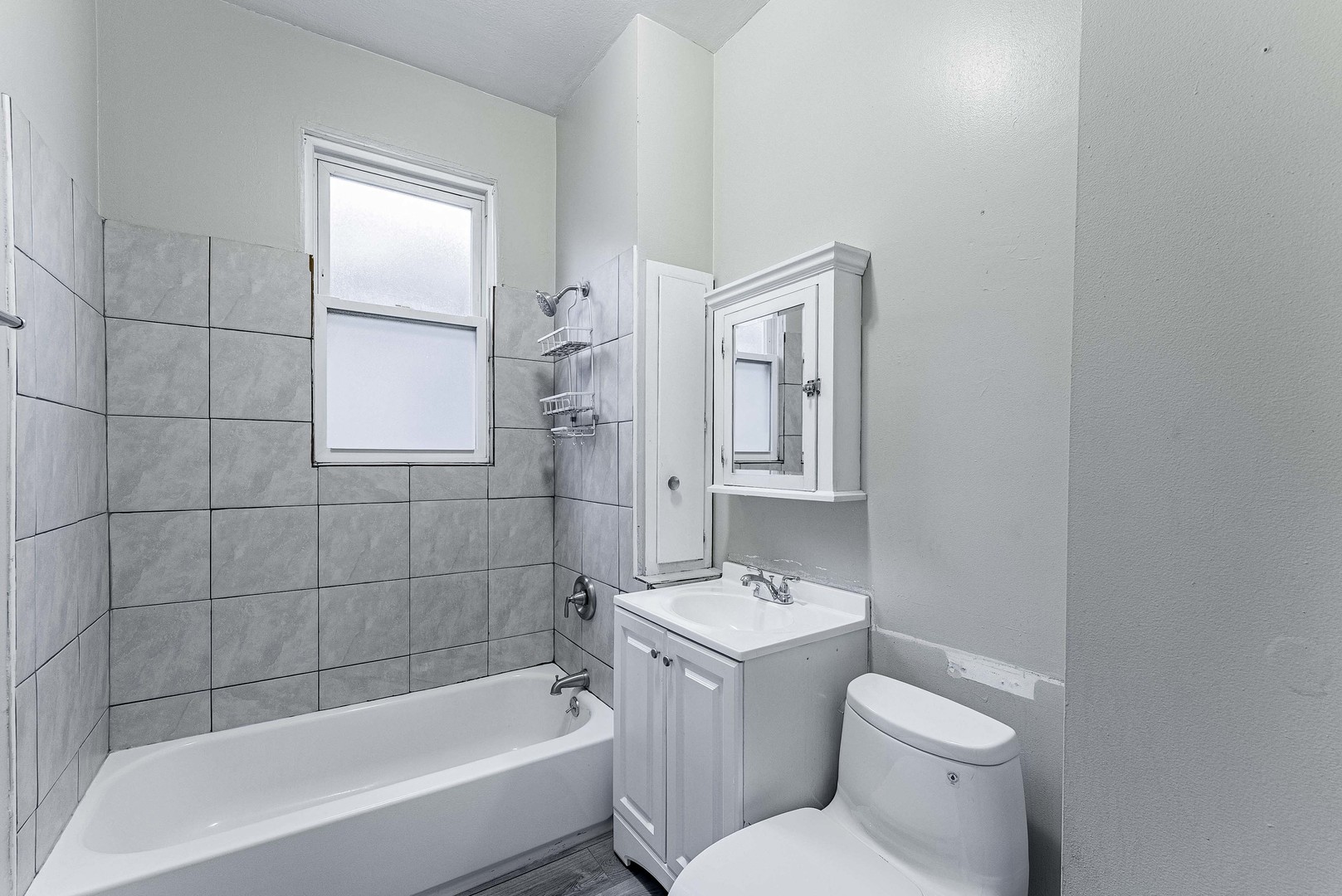1330 Ridgeland Avenue Berwyn, IL 60402 - Photo 8 of 23 a bathroom with a toilet a sink and bathtub