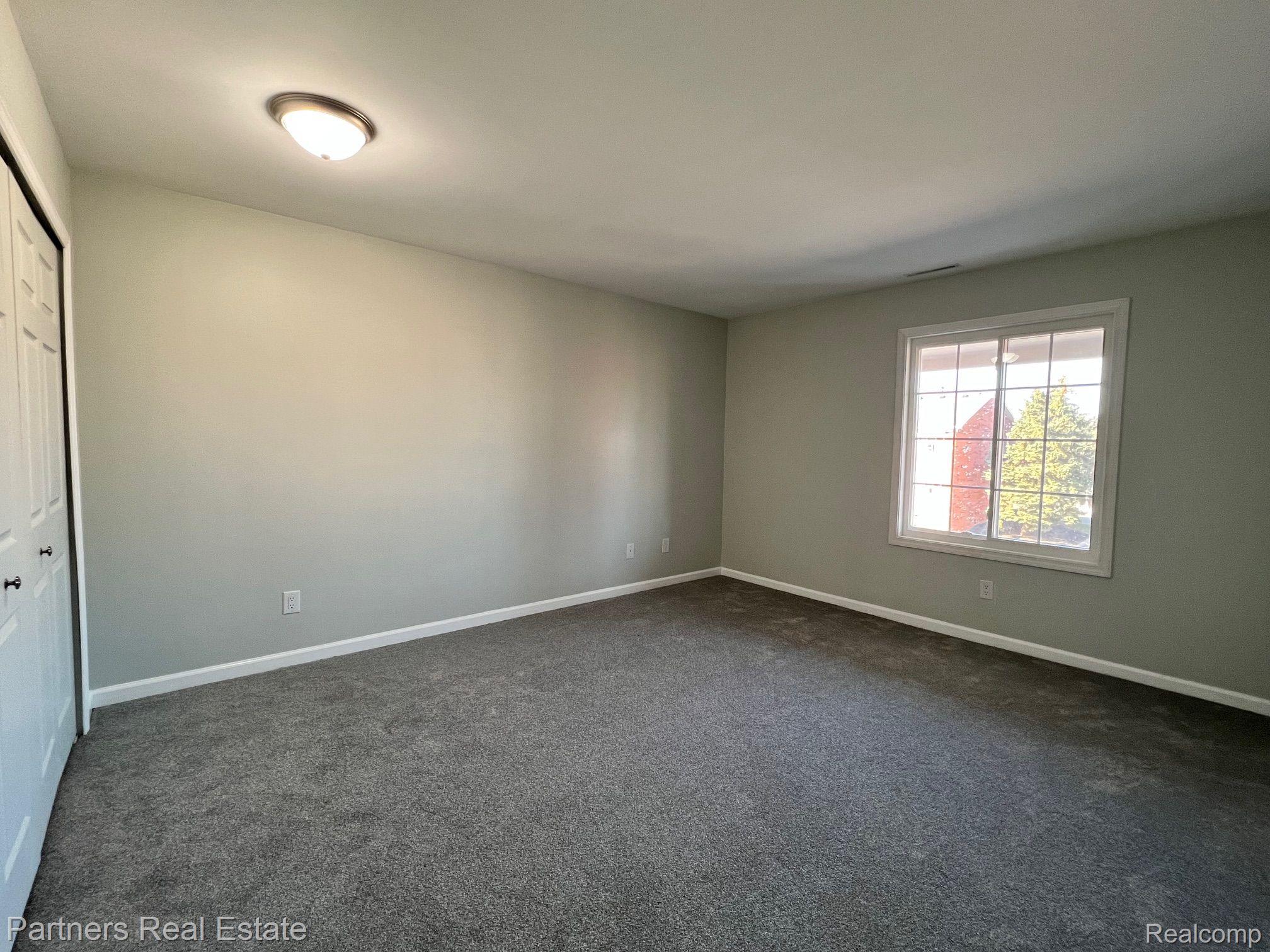 505 West Highland Road, Unit C10 Howell, MI 48843 - Photo 16 of 29 Primary Bedroom - Double Closet
