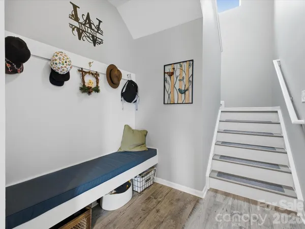 a bed room with furniture and a chair