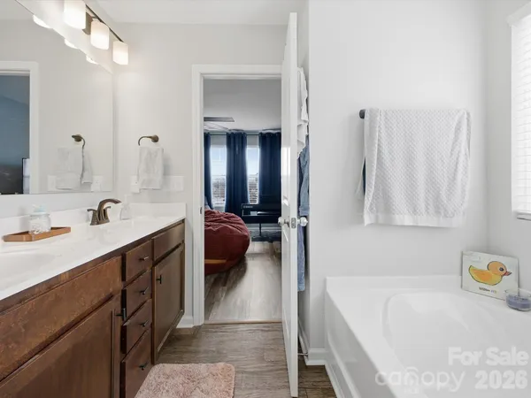 a bedroom with furniture and a flat screen tv