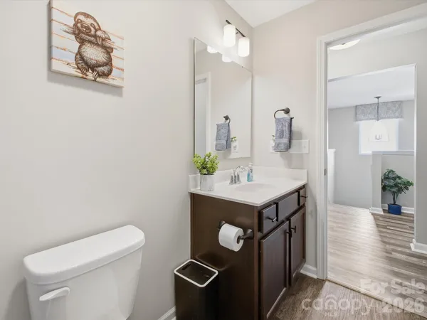 a view of a workspace with furniture and wooden floor
