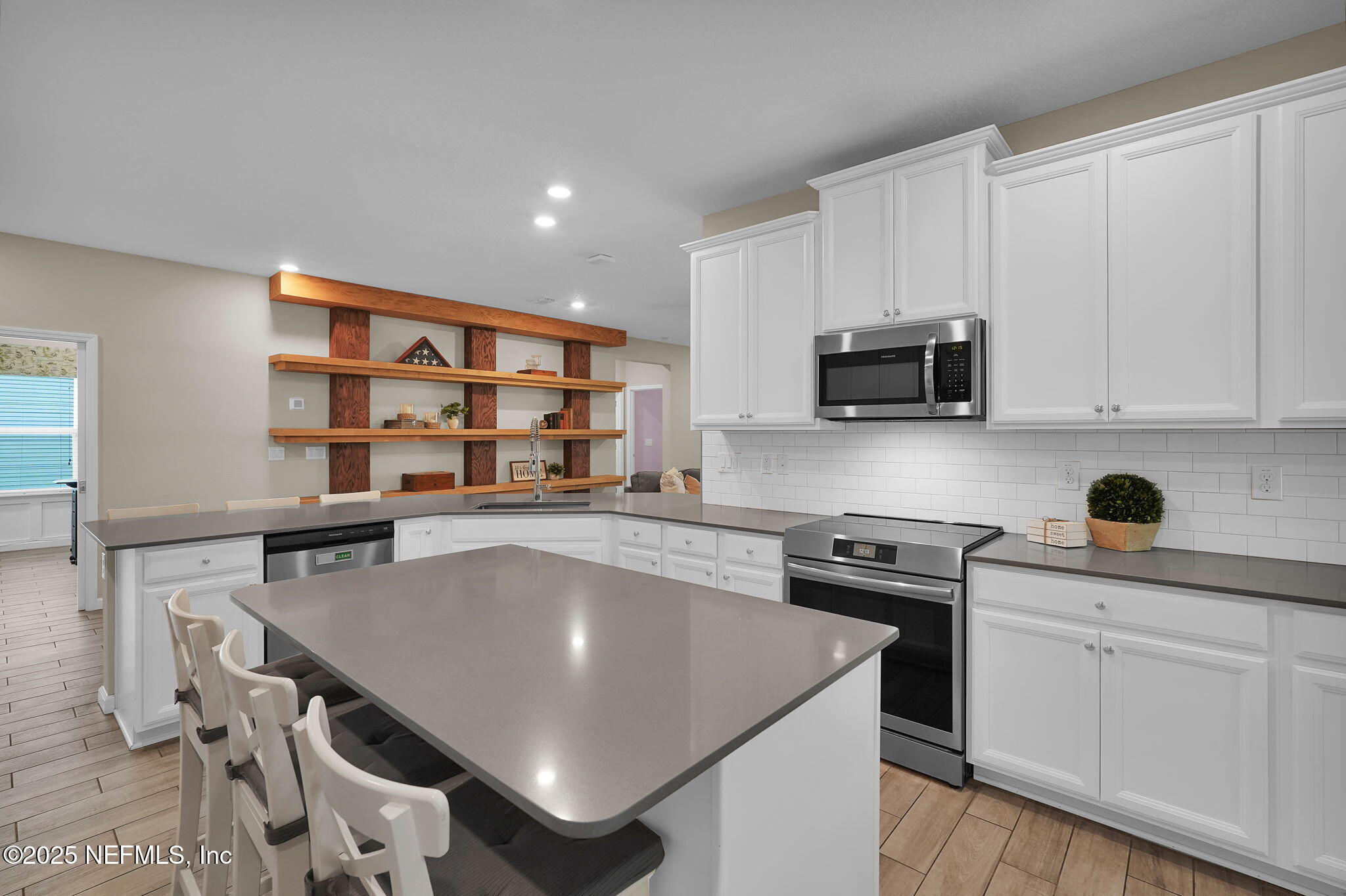 44 Athens Drive St. Augustine, FL 32092 - Photo 15 of 46 a kitchen with stainless steel appliances a stove a sink dishwasher and cabinets