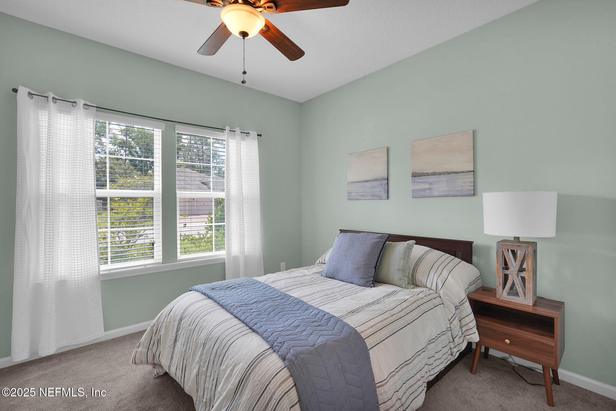 44 Athens Drive St. Augustine, FL 32092 - Photo 23 of 46 a bedroom with a large bed and a window