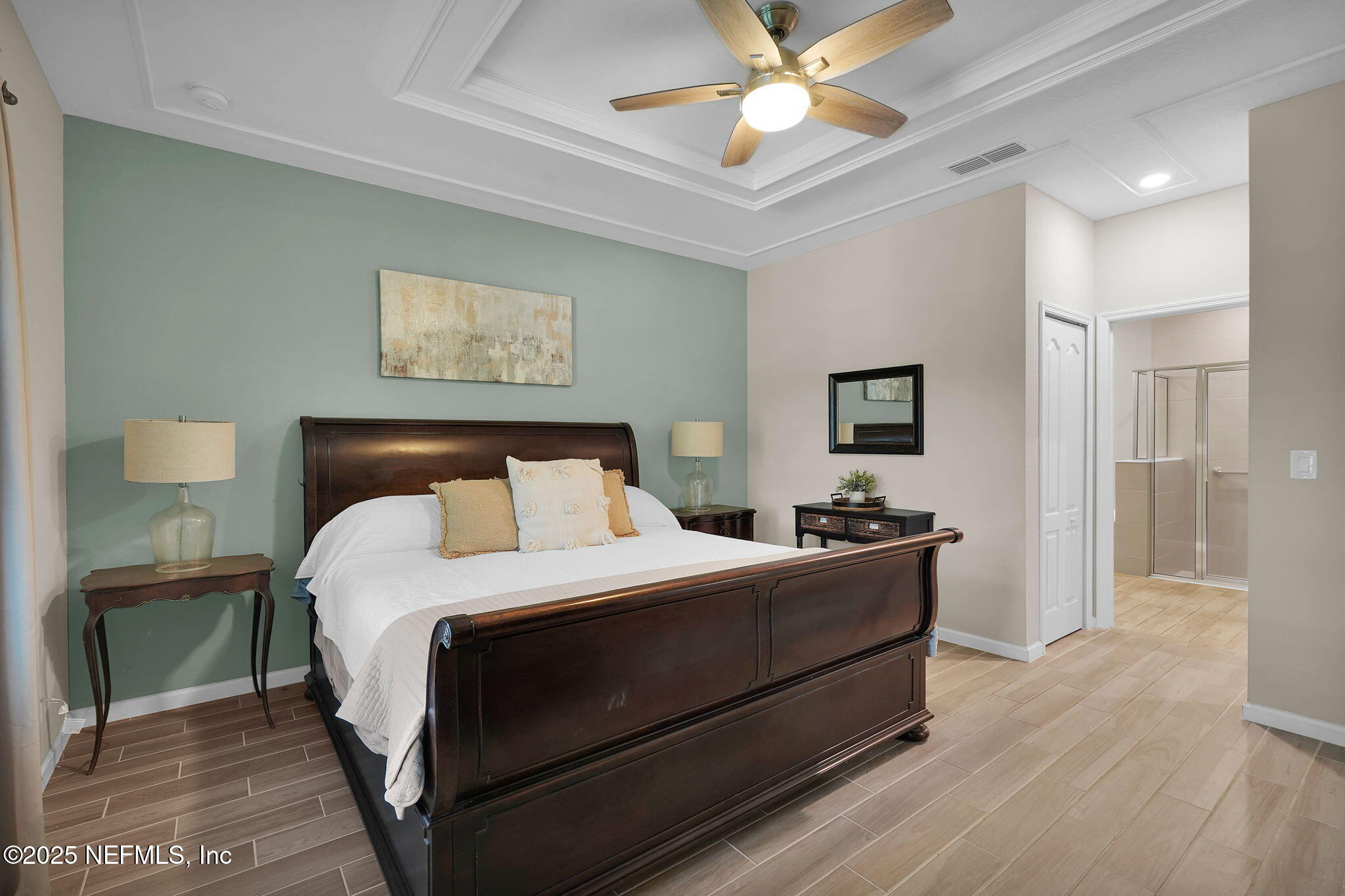 44 Athens Drive St. Augustine, FL 32092 - Photo 26 of 46 a bedroom with a bed and a chandelier