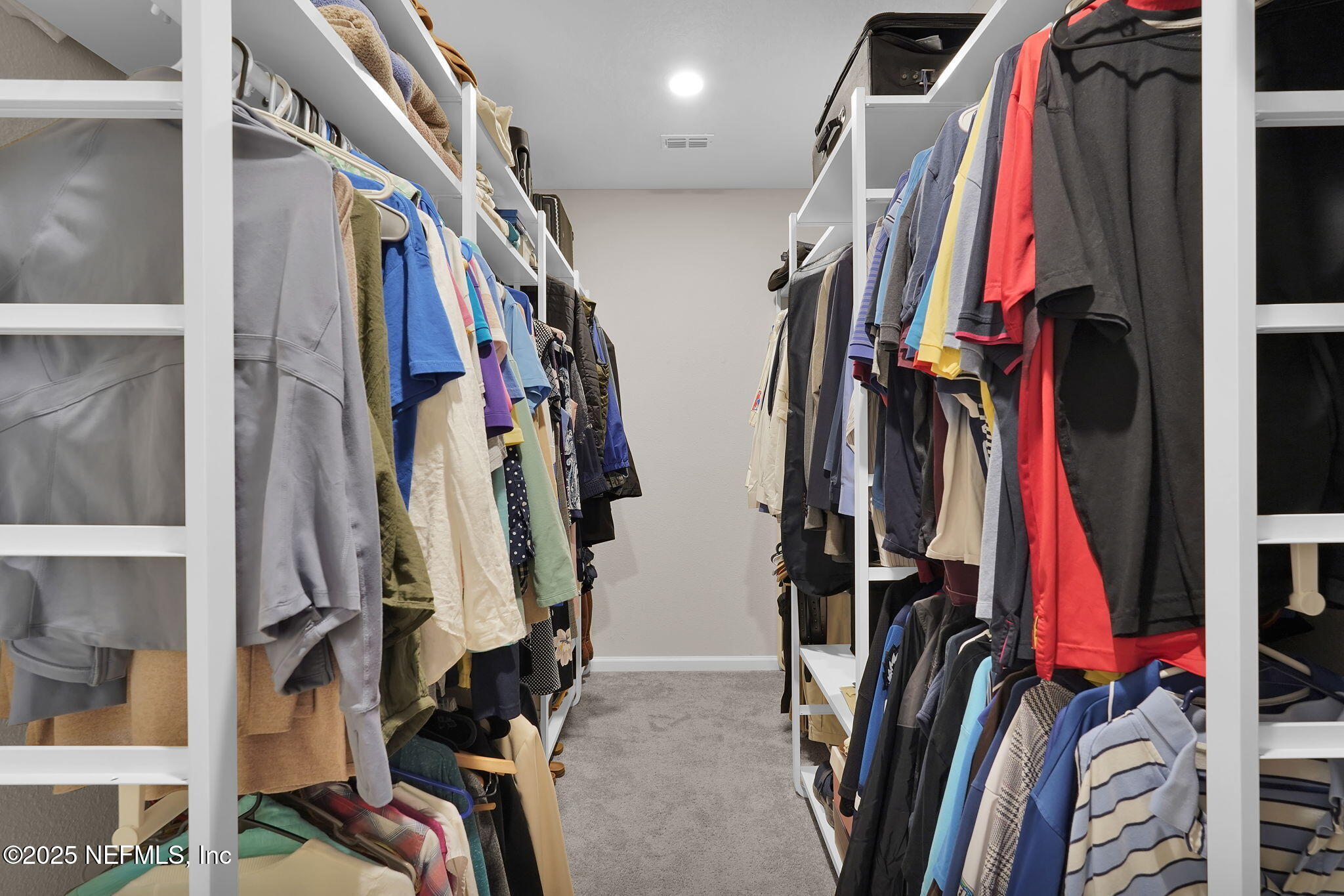 44 Athens Drive St. Augustine, FL 32092 - Photo 27 of 46 a view of walk in closet with clothes