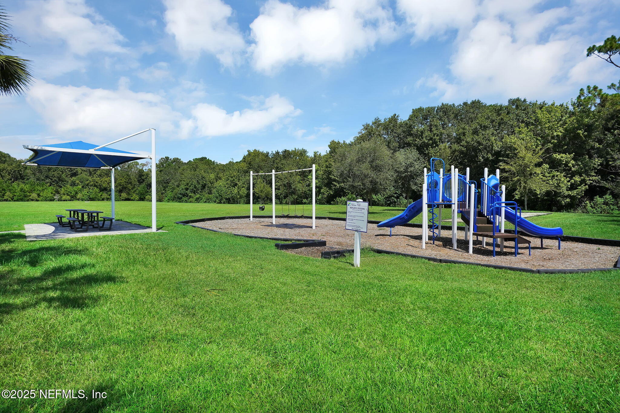 44 Athens Drive St. Augustine, FL 32092 - Photo 44 of 46 a view of a park with swings and slides