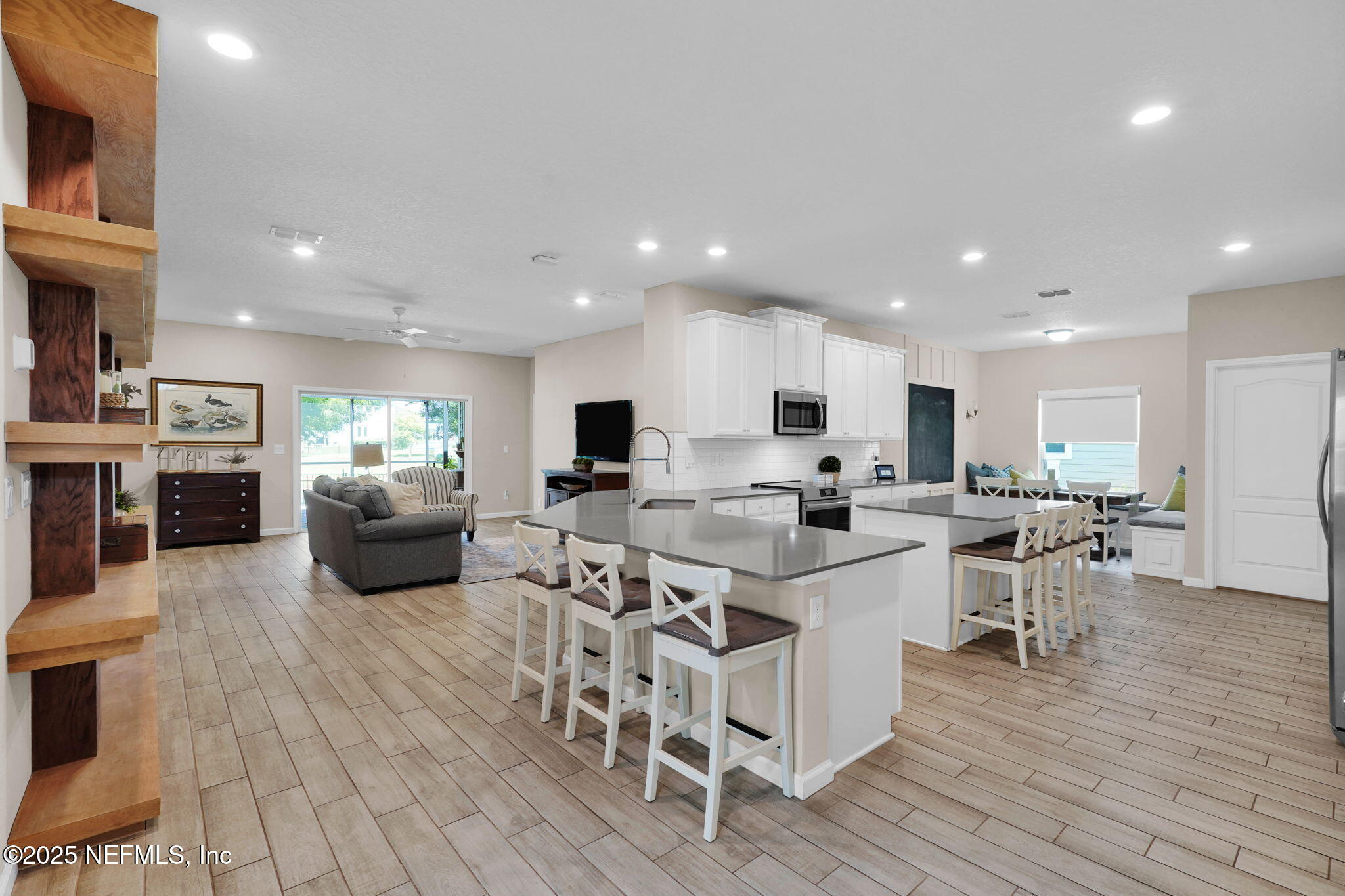 44 Athens Drive St. Augustine, FL 32092 - Photo 5 of 46 a large kitchen with a table and chairs in it