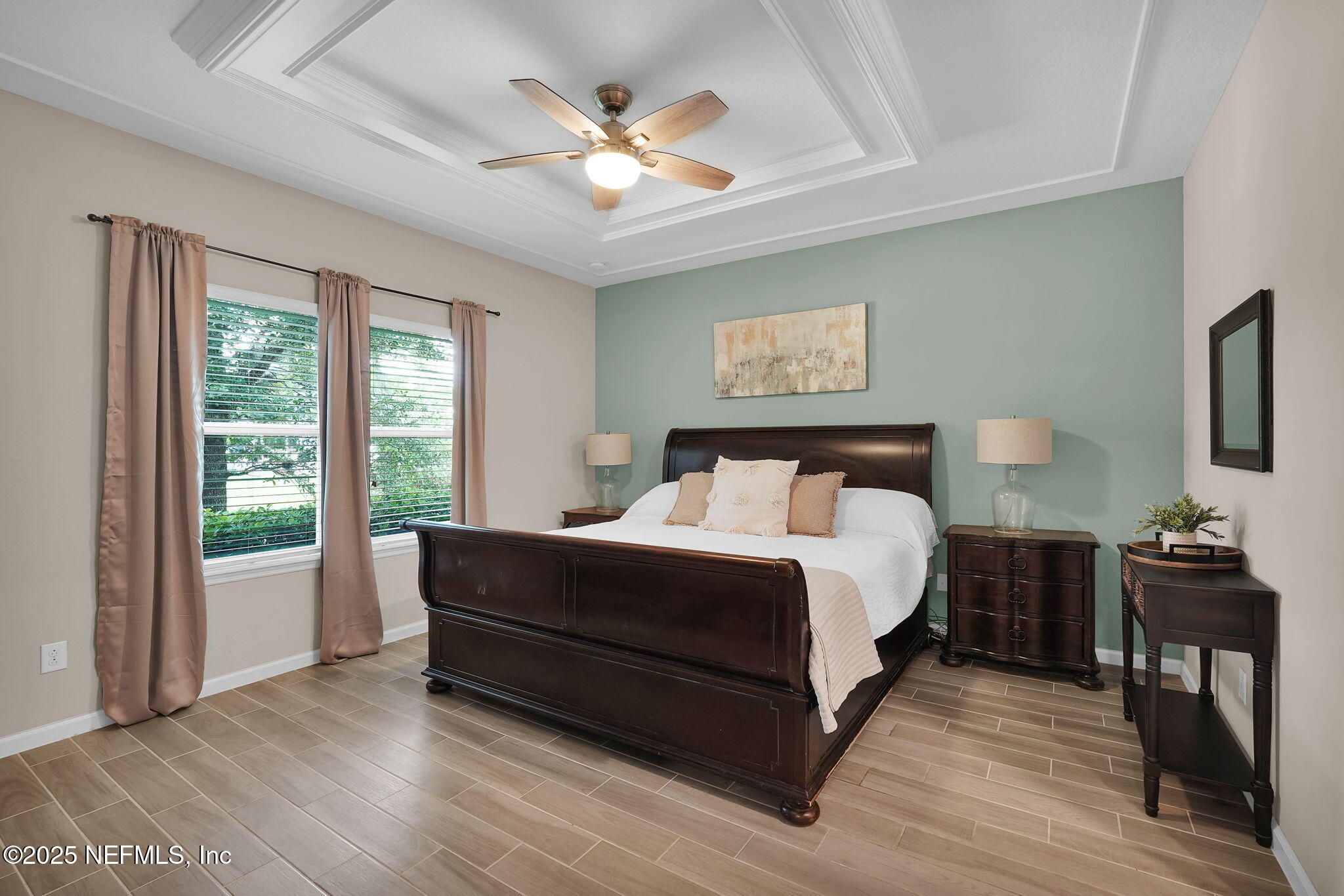 44 Athens Drive St. Augustine, FL 32092 - Photo 6 of 46 a bedroom with a bed and a chandelier