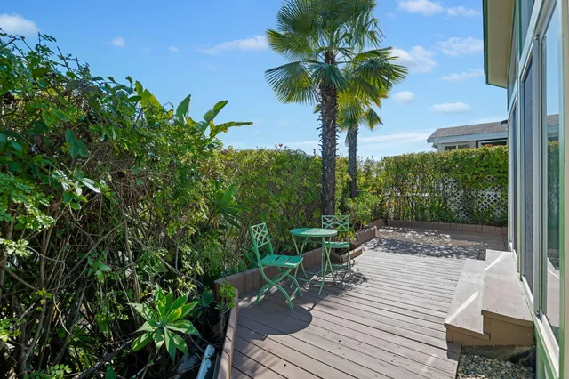 a view of a backyard with sitting area
