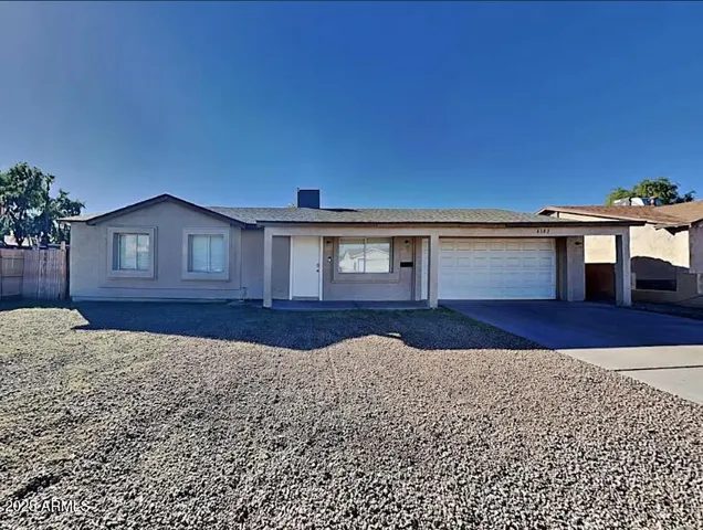 a view of front of house with a yard
