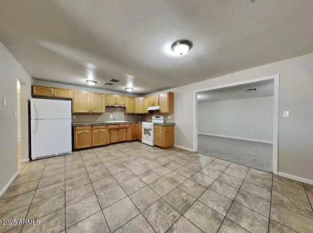 an empty room with closet area