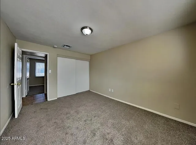 a view of an empty room and window