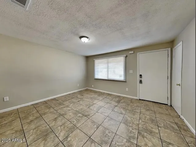 an empty room with a sink