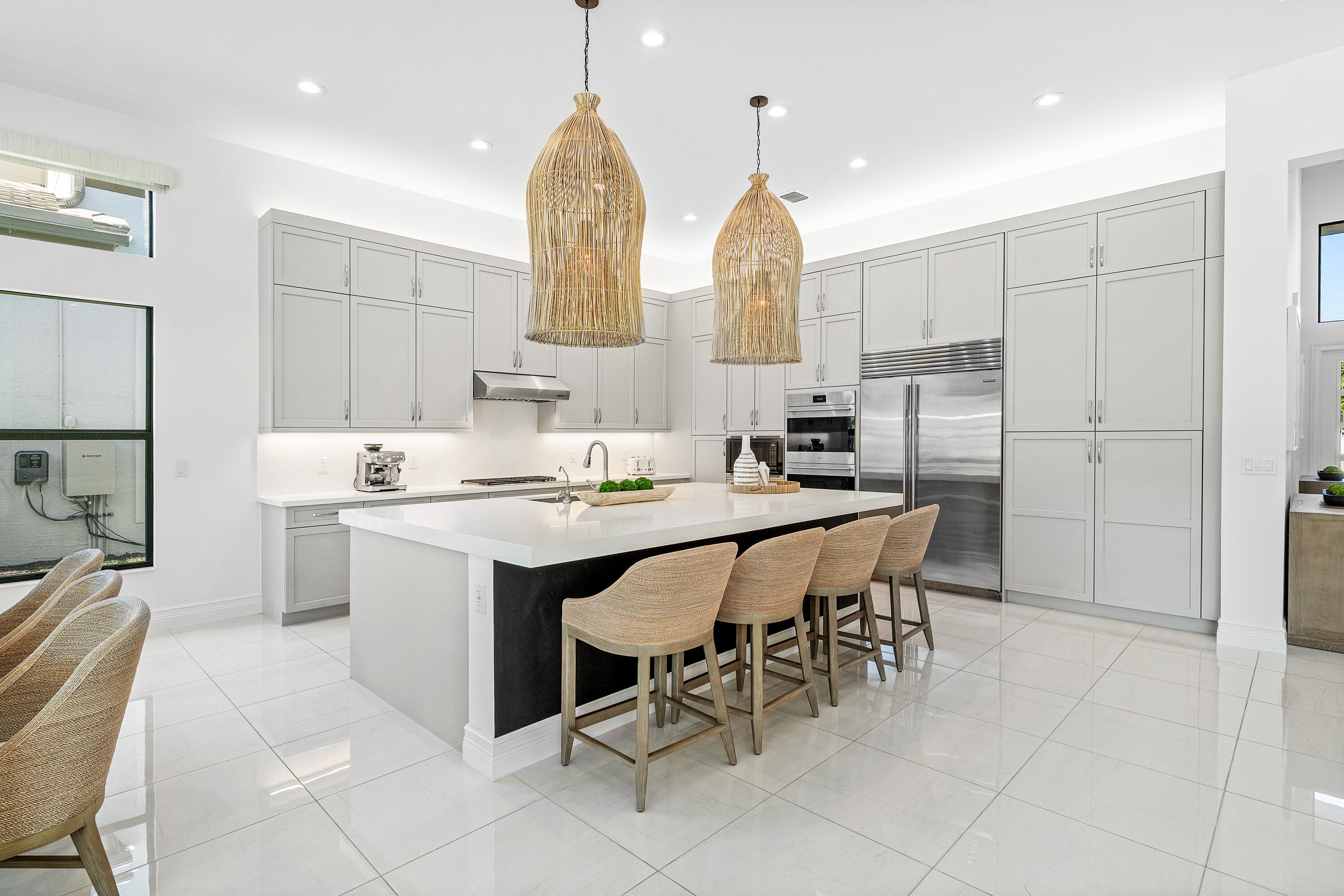 9594 Vescovato Way Boca Raton, FL 33496 - Photo 12 of 67 a kitchen with stainless steel appliances a sink stove and white cabinets