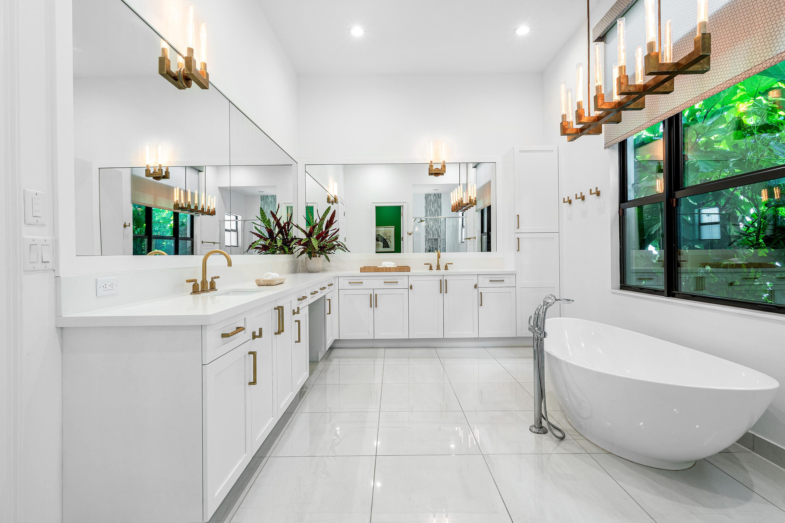 9594 Vescovato Way Boca Raton, FL 33496 - Photo 21 of 67 a bathroom with a double vanity sink a mirror and a bathtub