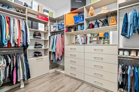 a view of a storage & utility room with racks on the wall