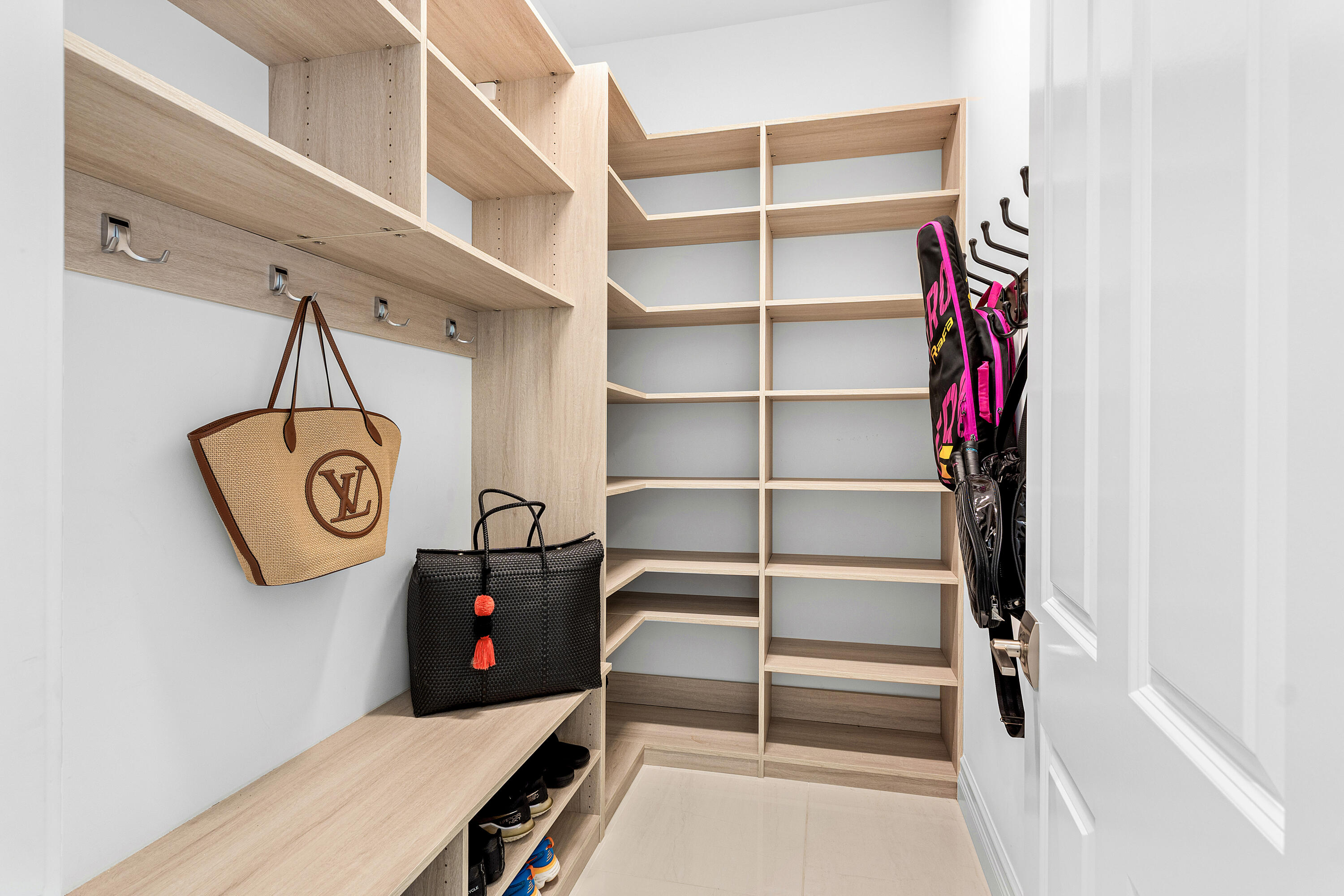 9594 Vescovato Way Boca Raton, FL 33496 - Photo 29 of 67 a view of a storage & utility room with racks on the wall