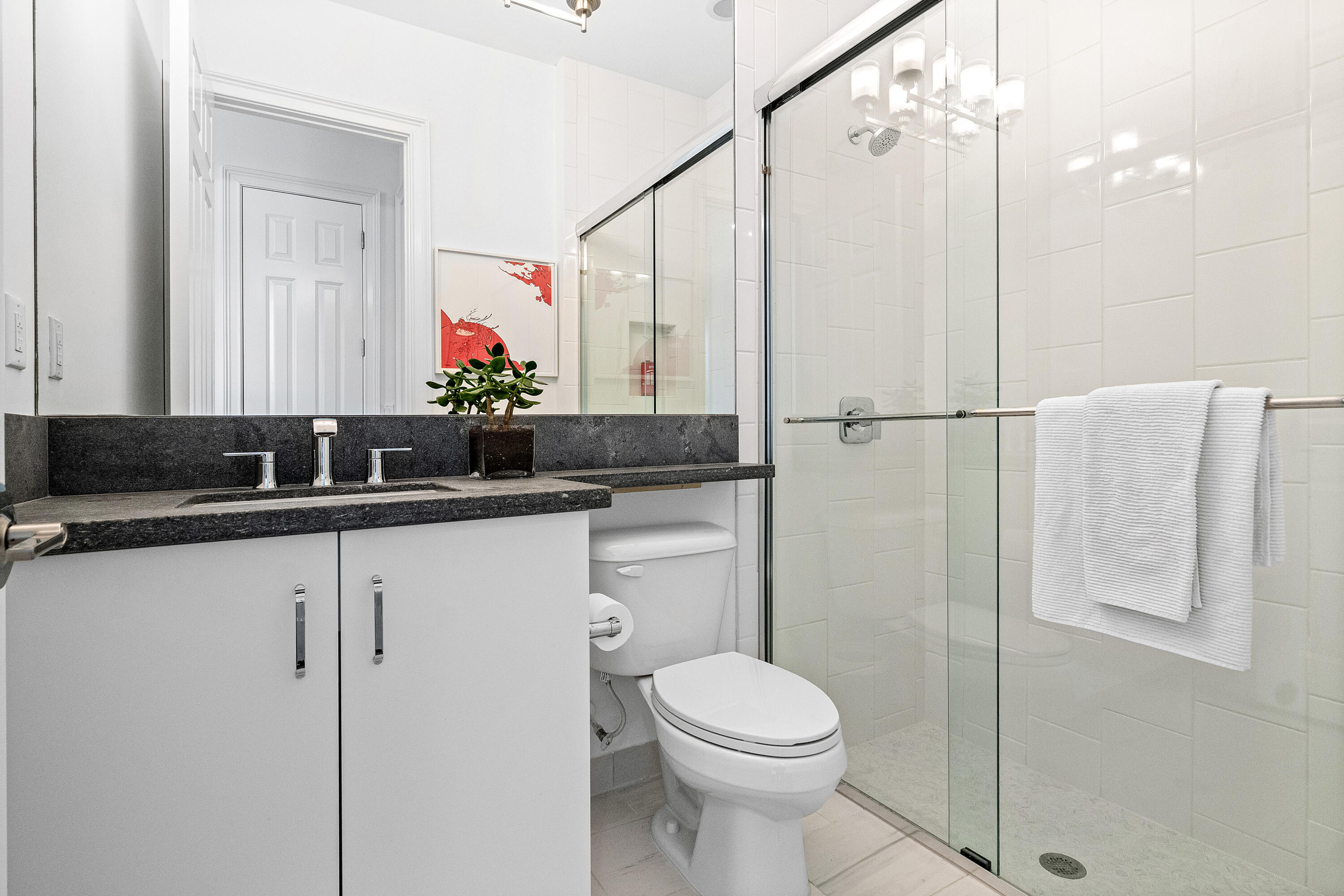 9594 Vescovato Way Boca Raton, FL 33496 - Photo 31 of 67 a bathroom with a sink a toilet and a mirror