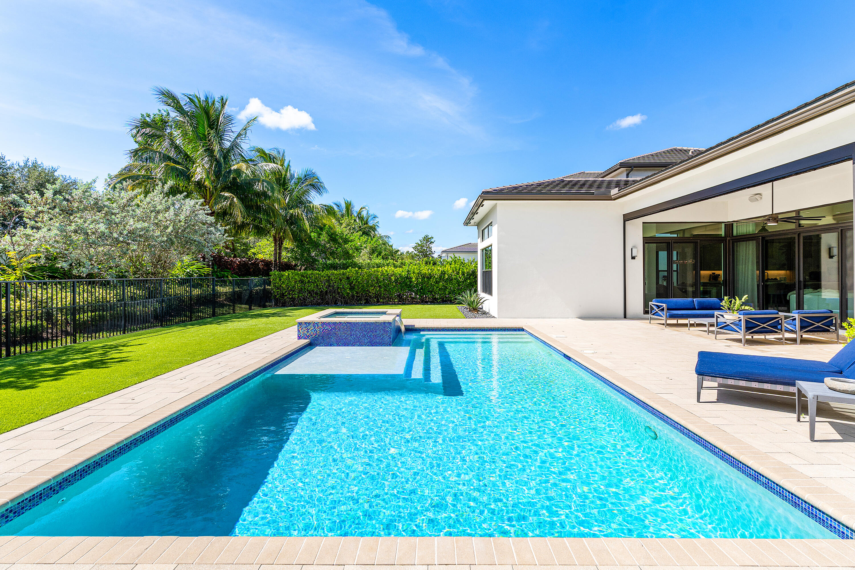 9594 Vescovato Way Boca Raton, FL 33496 - Photo 33 of 67 a swimming pool with outdoor seating and yard
