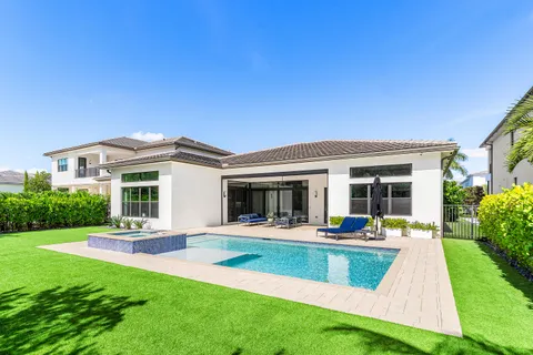 an aerial view of residential house with outdoor space and lake view